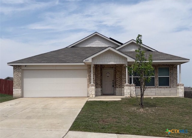 3805 Flat Rock Mountain Dr, Killeen, TX 76549 - view of front of property with concrete driveway, a front yard, brick siding, a garage, and fence