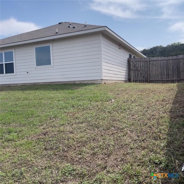 3805 Flat Rock Mountain Dr, Killeen, TX 76549 - view of side of property featuring fence and a lawn