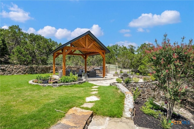 surrounding community featuring a patio, fence, an outdoor living space, a yard, and a gazebo