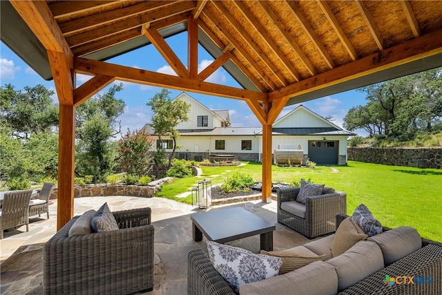 view of patio / terrace featuring an outdoor living space, a gazebo, and an outdoor structure