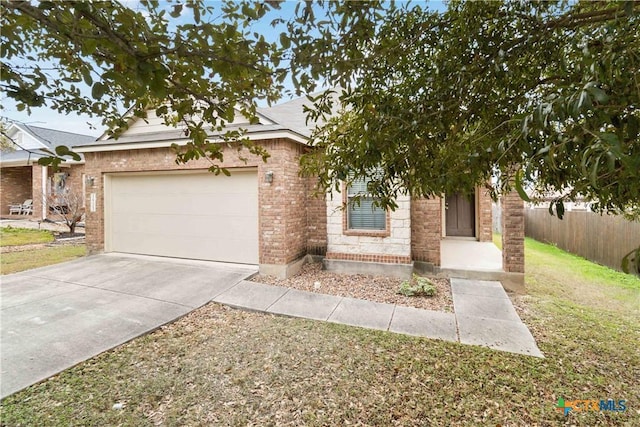 view of front of house featuring a front yard and a garage