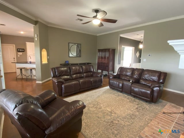 406 Windy Way Dr, Victoria, TX 77904 - living room featuring ceiling fan, crown molding, and wood finished floors