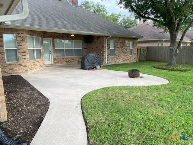 406 Windy Way Dr, Victoria, TX 77904 - view of yard featuring a fire pit and a patio