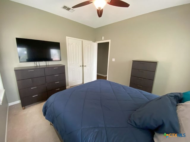 406 Windy Way Dr, Victoria, TX 77904 - bedroom with light colored carpet, a ceiling fan, and a closet