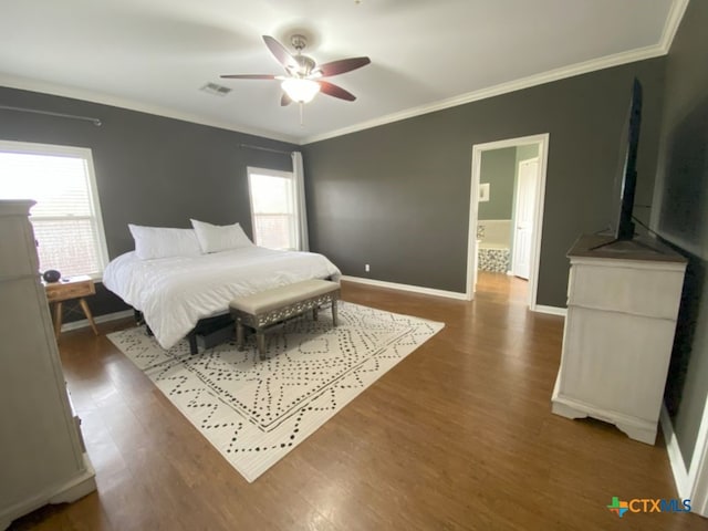 406 Windy Way Dr, Victoria, TX 77904 - bedroom with wood finished floors, crown molding, and a ceiling fan