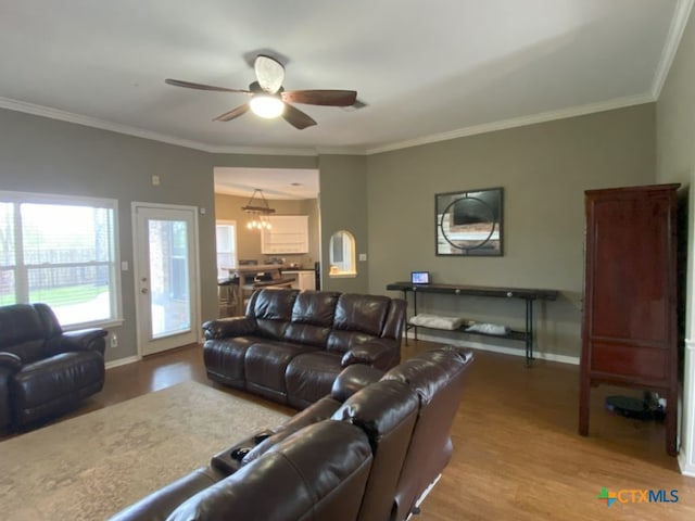 406 Windy Way Dr, Victoria, TX 77904 - living area with wood finished floors, ceiling fan, crown molding, and a chandelier