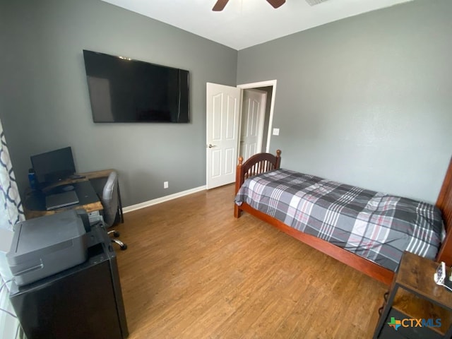 406 Windy Way Dr, Victoria, TX 77904 - bedroom with wood finished floors, a ceiling fan, and an office area