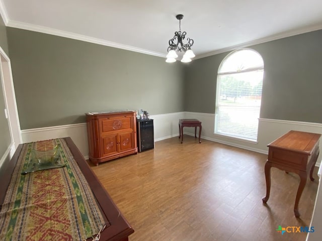 406 Windy Way Dr, Victoria, TX 77904 - living area with ornamental molding, light wood-style flooring, and a chandelier