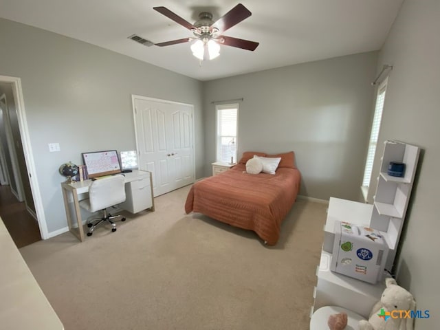 406 Windy Way Dr, Victoria, TX 77904 - bedroom featuring light colored carpet, a closet, ceiling fan, and an office area