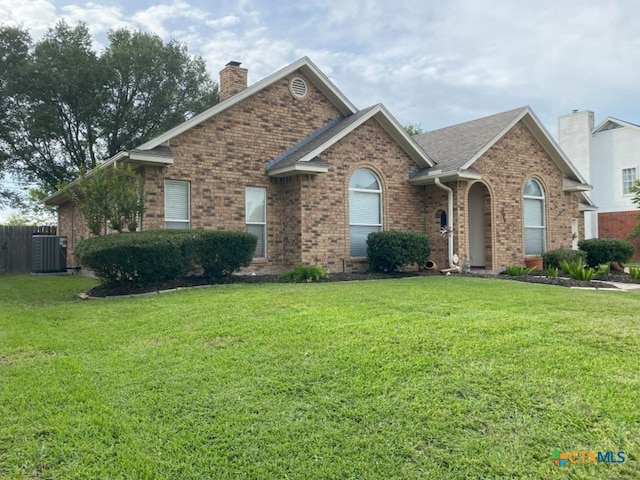 406 Windy Way Dr, Victoria, TX 77904 - view of front facade with a chimney and brick siding