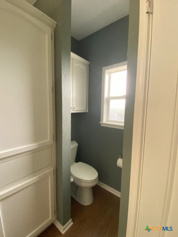 406 Windy Way Dr, Victoria, TX 77904 - bathroom with wood finished floors and toilet
