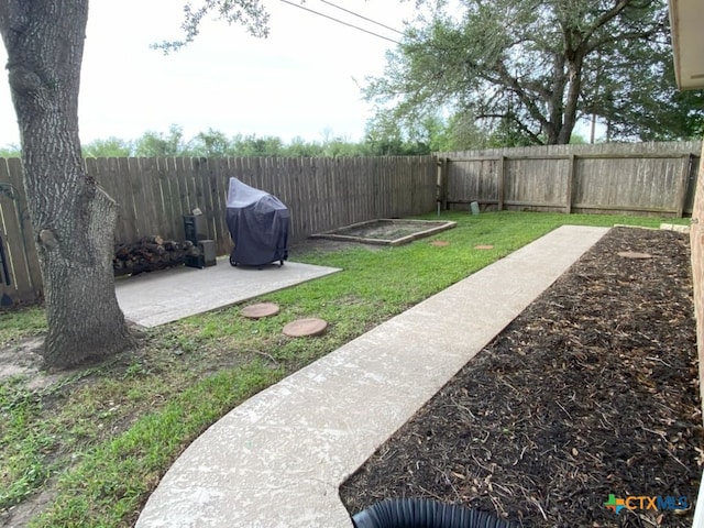 406 Windy Way Dr, Victoria, TX 77904 - fenced backyard featuring a patio area