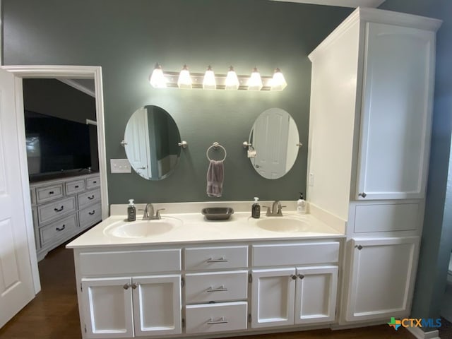 406 Windy Way Dr, Victoria, TX 77904 - bathroom with double vanity and wood finished floors