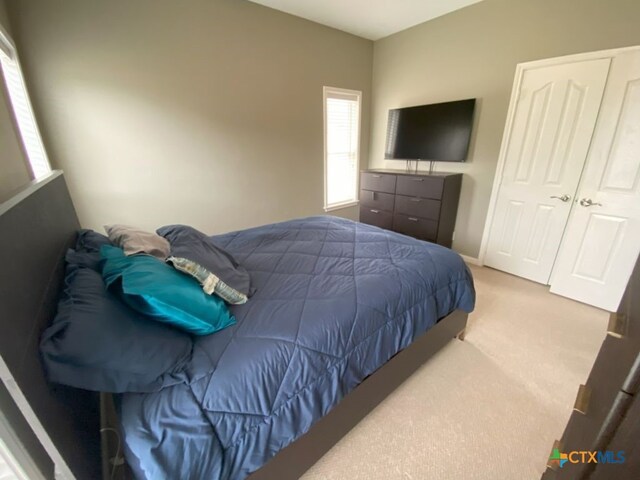 406 Windy Way Dr, Victoria, TX 77904 - bedroom featuring carpet flooring