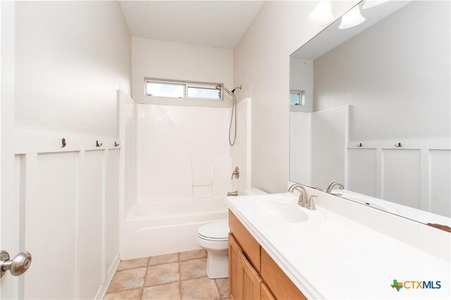 full bath featuring vanity, shower / bathing tub combination, and toilet