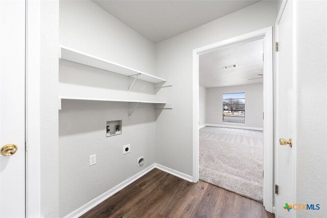 laundry room with hookup for an electric dryer, dark wood-type flooring, and hookup for a washing machine