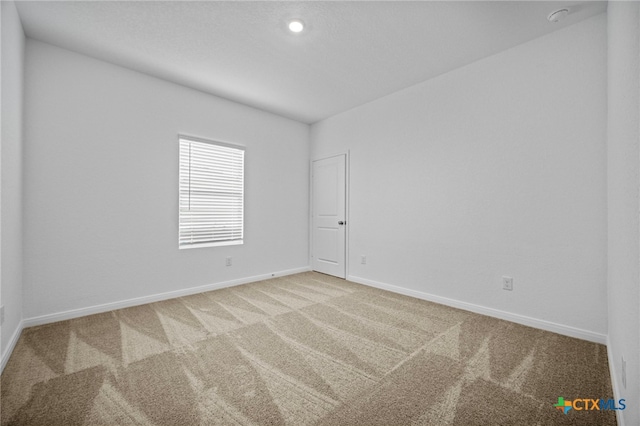 unfurnished room with carpet floors