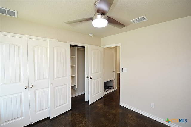 unfurnished bedroom with a textured ceiling and ceiling fan