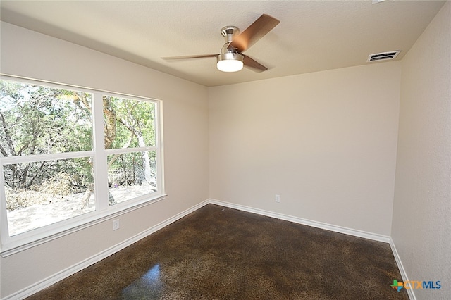 spare room featuring ceiling fan and a textured ceiling