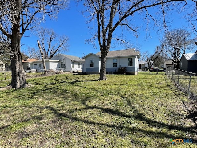 view of yard with fence and a residential view