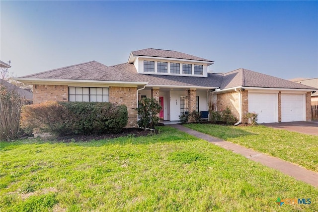 view of front of property with brick siding, a shingled roof, a front lawn, a garage, and driveway