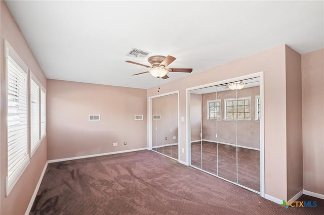 unfurnished bedroom with visible vents, baseboards, and carpet