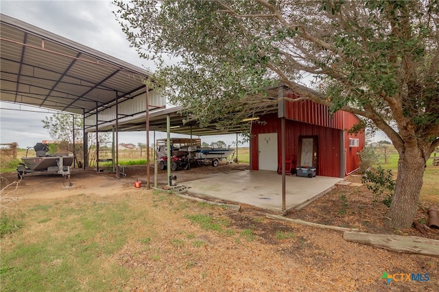 view of vehicle parking with a carport