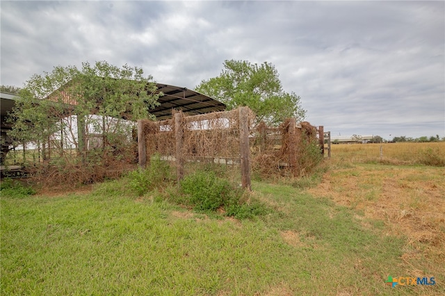 view of yard with a rural view