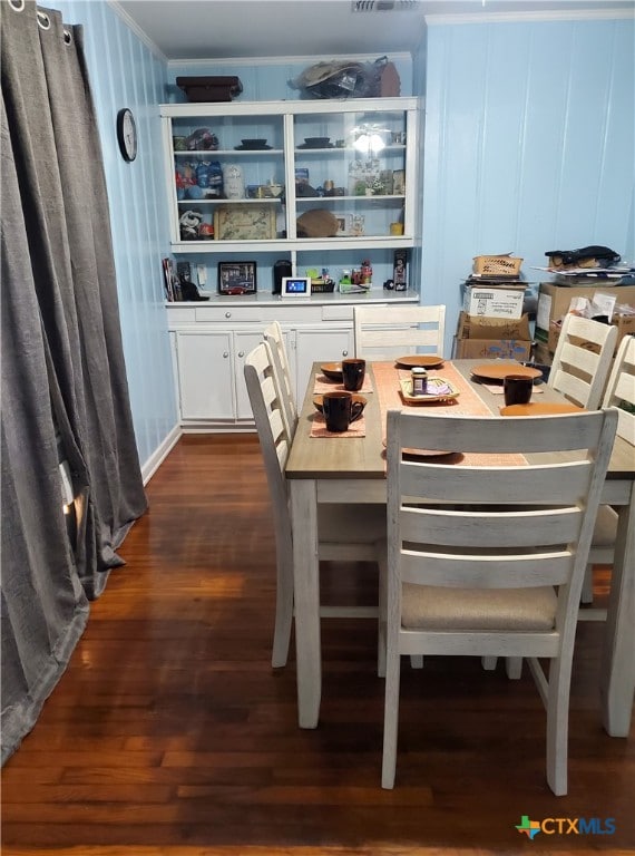 dining area featuring dark hardwood / wood-style flooring