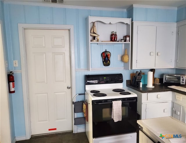 kitchen featuring white cabinets, crown molding, and electric range