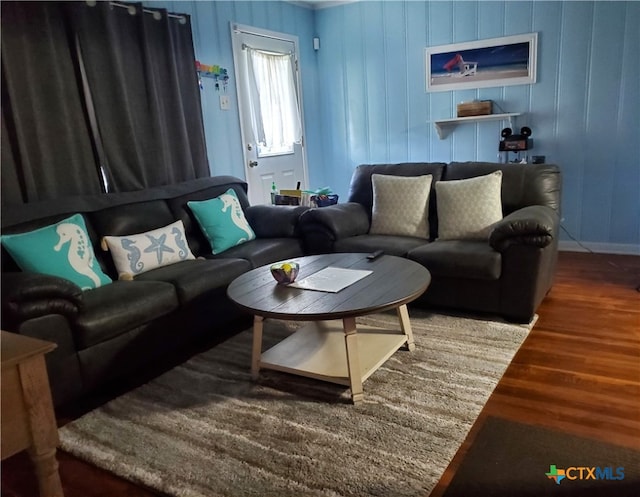 living room with dark hardwood / wood-style flooring