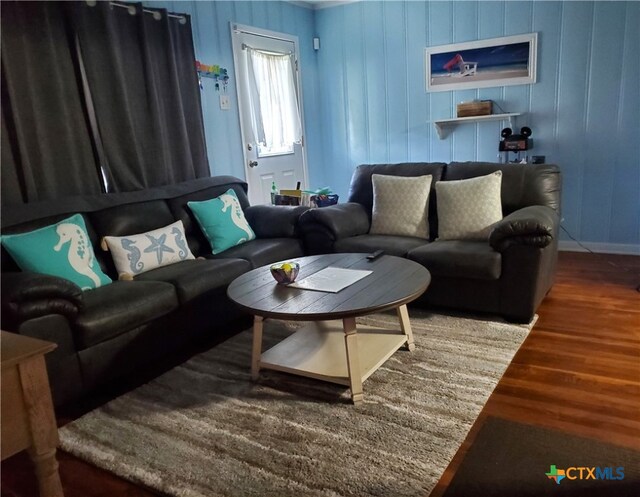 living room with dark hardwood / wood-style flooring