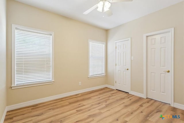 104 Twelve Oaks Dr, Temple, TX 76504 - unfurnished bedroom with light wood-style flooring, baseboards, and a ceiling fan