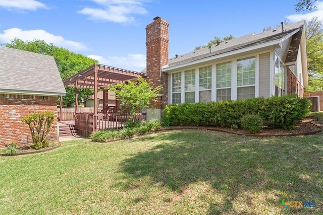 104 Twelve Oaks Dr, Temple, TX 76504 - rear view of house featuring a pergola, a yard, a wooden deck, and a chimney