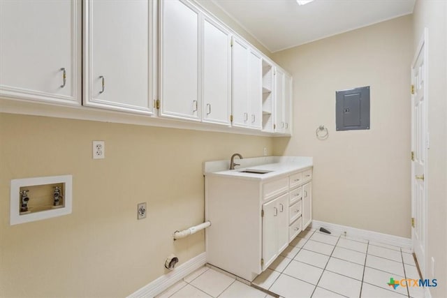 104 Twelve Oaks Dr, Temple, TX 76504 - laundry room with light tile patterned floors, hookup for a washing machine, electric panel, a sink, and cabinet space