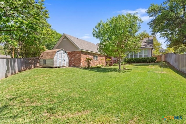 104 Twelve Oaks Dr, Temple, TX 76504 - view of yard with a fenced backyard, an outdoor structure, and a storage unit
