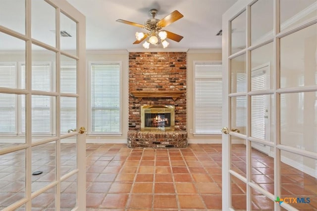 104 Twelve Oaks Dr, Temple, TX 76504 - unfurnished living room with a fireplace, light tile patterned floors, ornamental molding, and ceiling fan