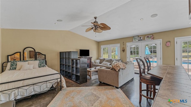 bedroom with multiple windows, access to exterior, vaulted ceiling, and french doors