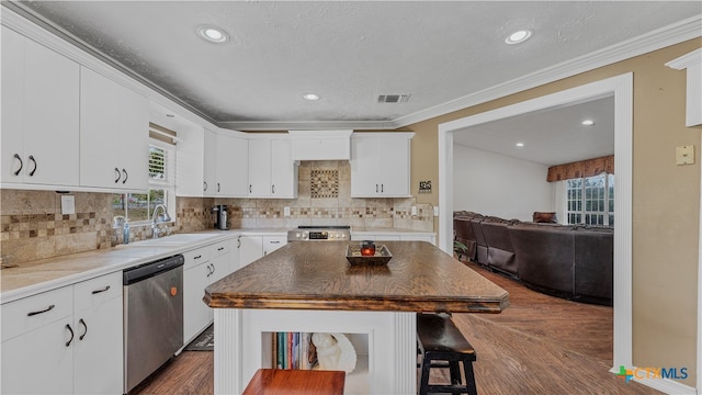 kitchen with white cabinetry, sink, dark hardwood / wood-style floors, and appliances with stainless steel finishes