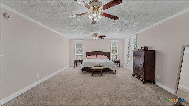 carpeted bedroom featuring ceiling fan, ornamental molding, and a textured ceiling