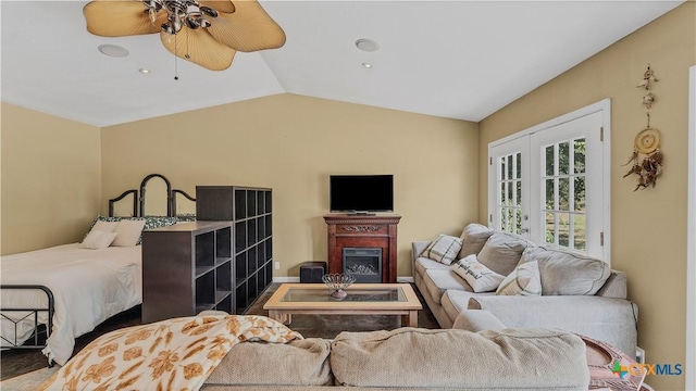 living room with vaulted ceiling and ceiling fan