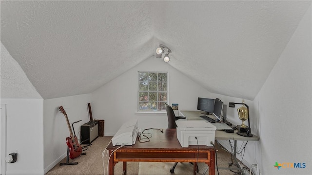 carpeted home office with vaulted ceiling and a textured ceiling