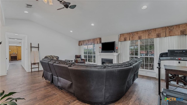 living room with lofted ceiling, dark hardwood / wood-style flooring, and ceiling fan