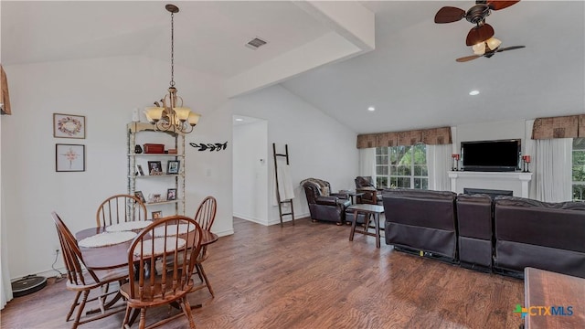 dining room featuring vaulted ceiling, dark wood-type flooring, and ceiling fan with notable chandelier