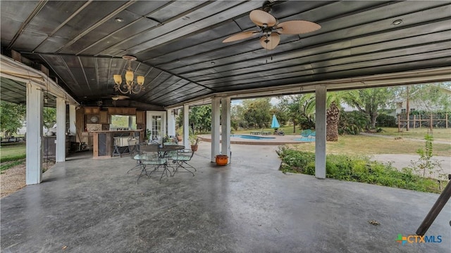 view of patio with ceiling fan and area for grilling