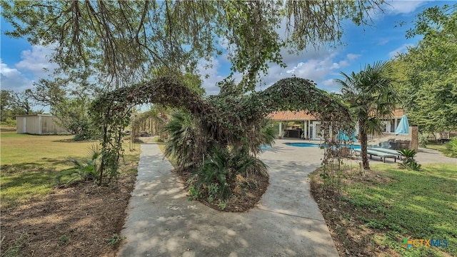 view of front of house featuring a gazebo, a patio area, and a front lawn