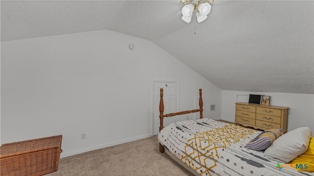 carpeted bedroom with lofted ceiling, ceiling fan, and a textured ceiling