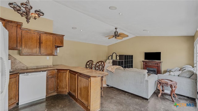 kitchen featuring ceiling fan, white dishwasher, kitchen peninsula, and vaulted ceiling