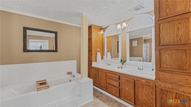 bathroom featuring crown molding, tile patterned floors, a tub, and a textured ceiling