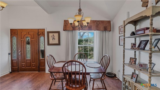 dining area featuring vaulted ceiling with beams, dark wood-type flooring, and a chandelier